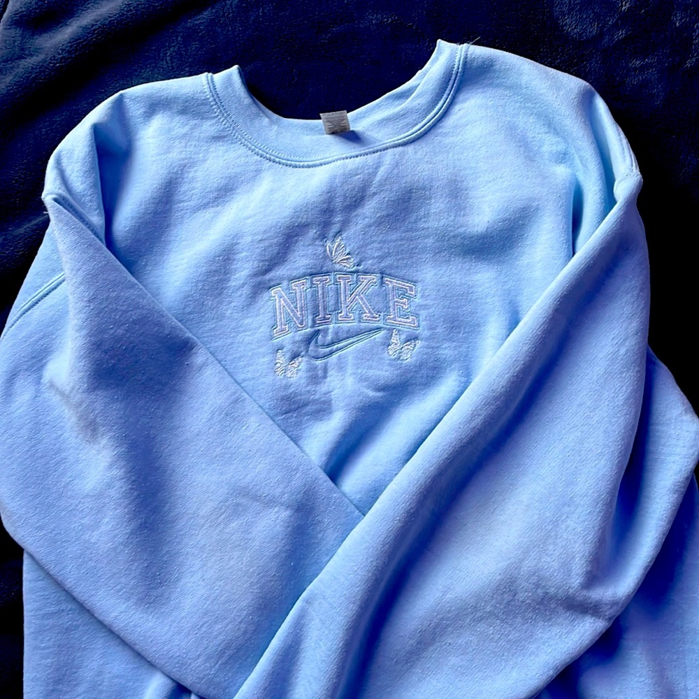 light blue crewneck with nike logo